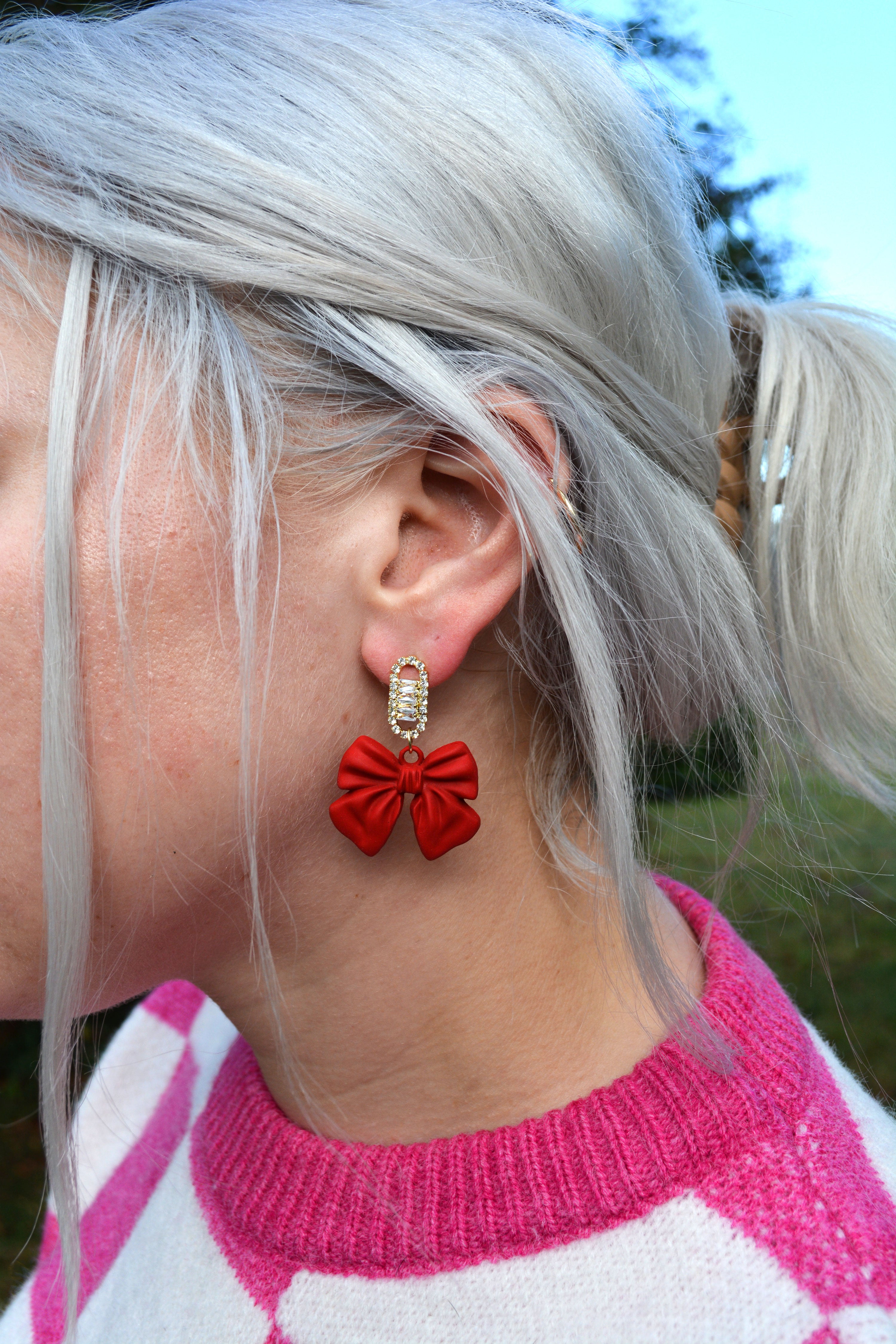 Red bow store earrings